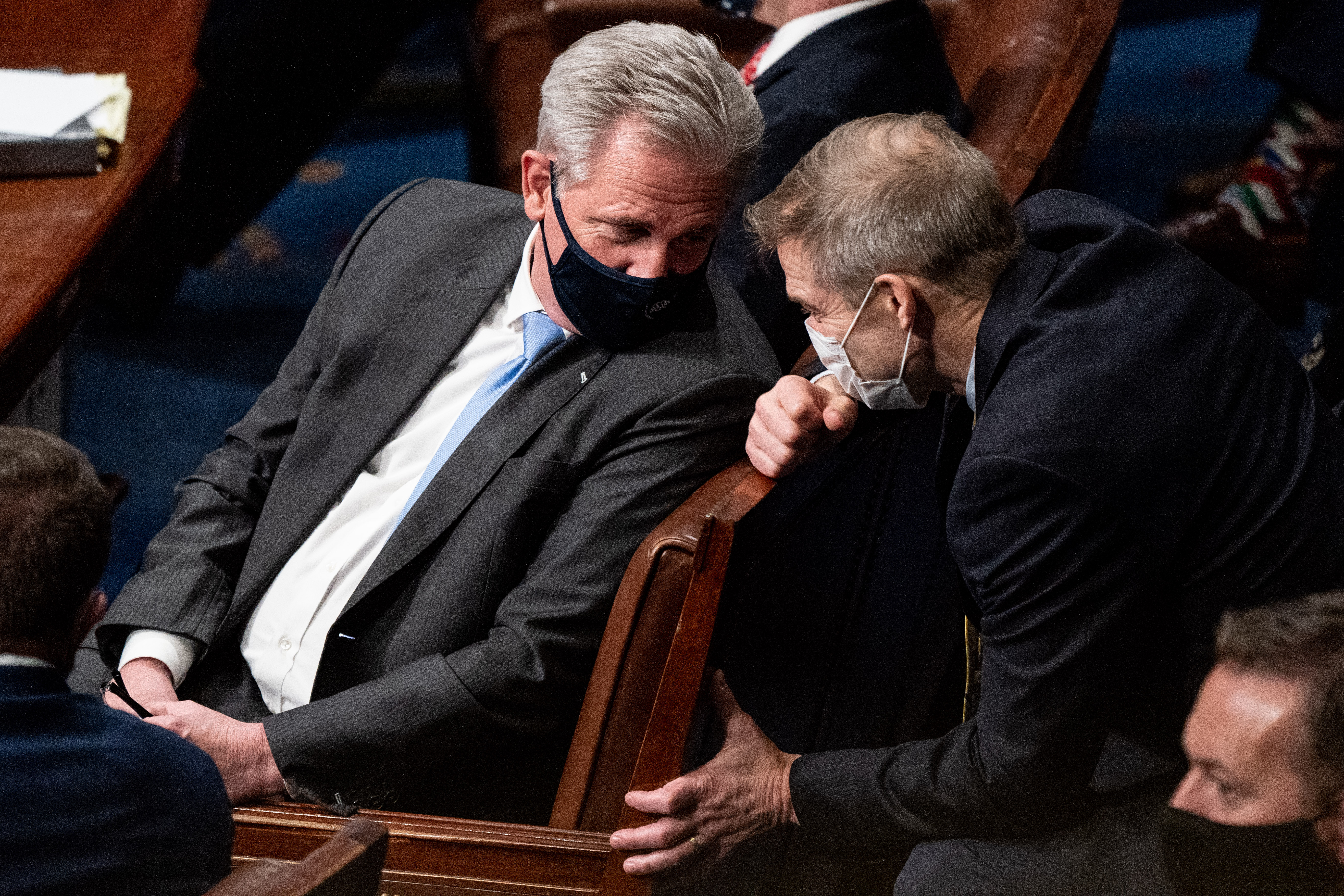 House Minority Leader Kevin McCarthy (R-CA) and Rep. Jim Jordan (R-OH) talk during a joint session of Congress on Jan. 6, 2021 in Washington, DC. Congress has reconvened to ratify President-elect Joe Biden's 306-232 Electoral College win over President Donald Trump, hours after a pro-Trump mob broke into the U.S. Capitol and disrupted proceedings. (Erin Schaff - Pool/Getty Images)