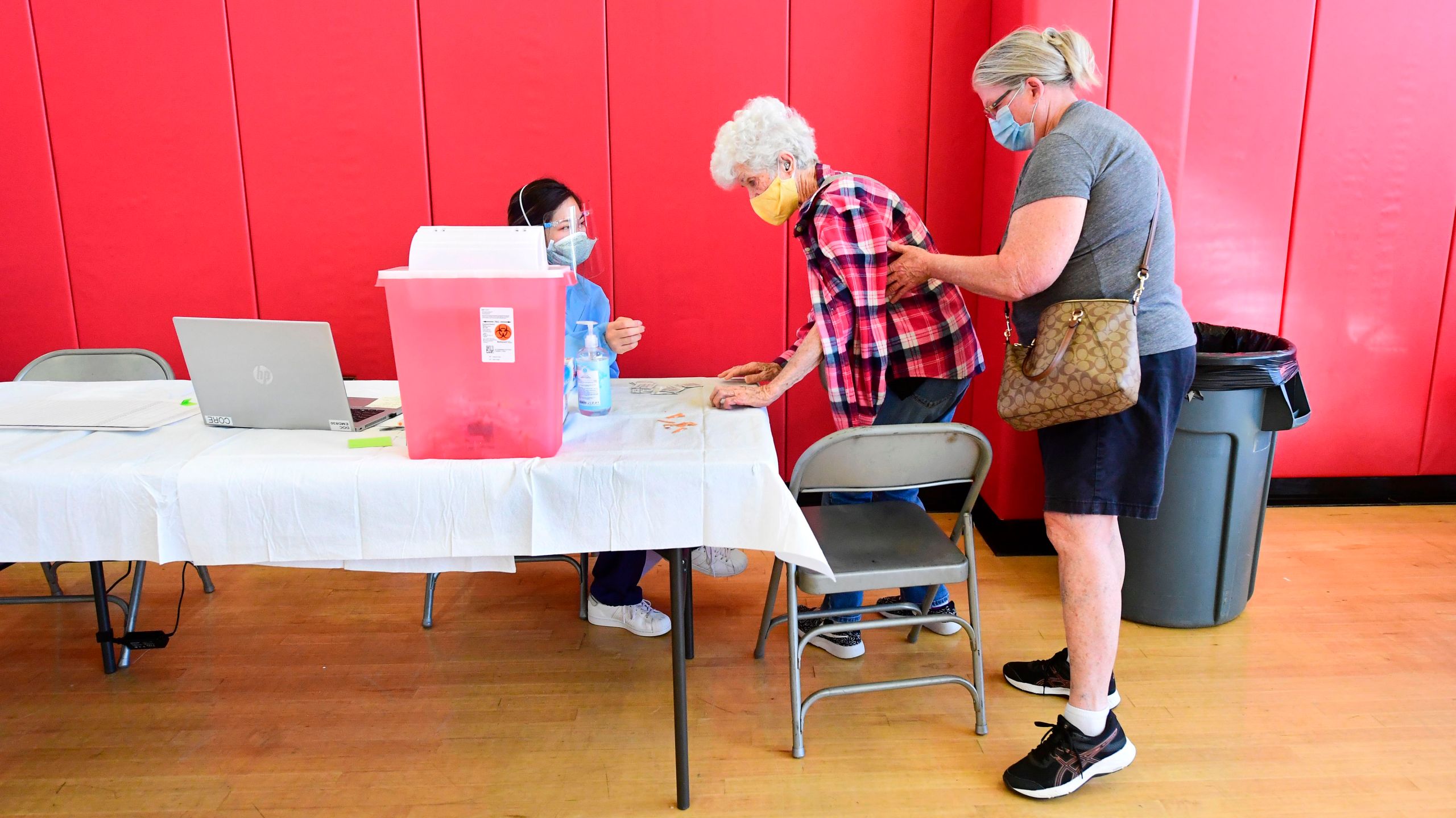 Beverly Goad, 89, arrives for her COVID-19 vaccine at the Corona High School gymnasium in Corona on Jan. 15, 2021. (FREDERIC J. BROWN/AFP via Getty Images)