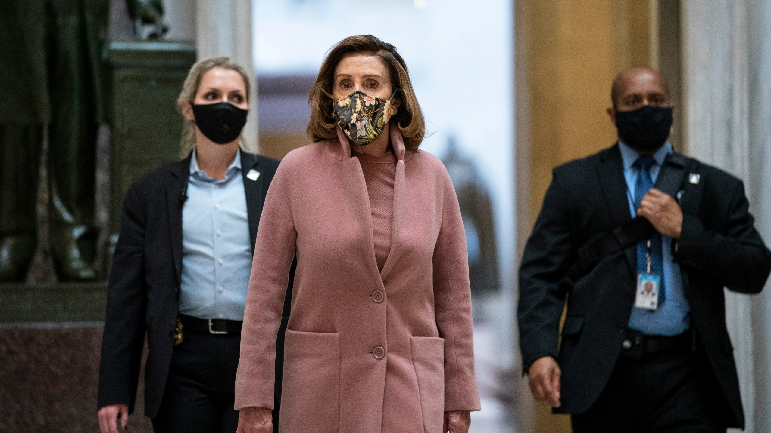 Accompanied by her security detail, Speaker of the House Nancy Pelosi (D-CA) leaves her office and walks to the House Chamber at the U.S. Capitol on Jan. 21, 2021 in Washington, D.C. (Drew Angerer/Getty Images)