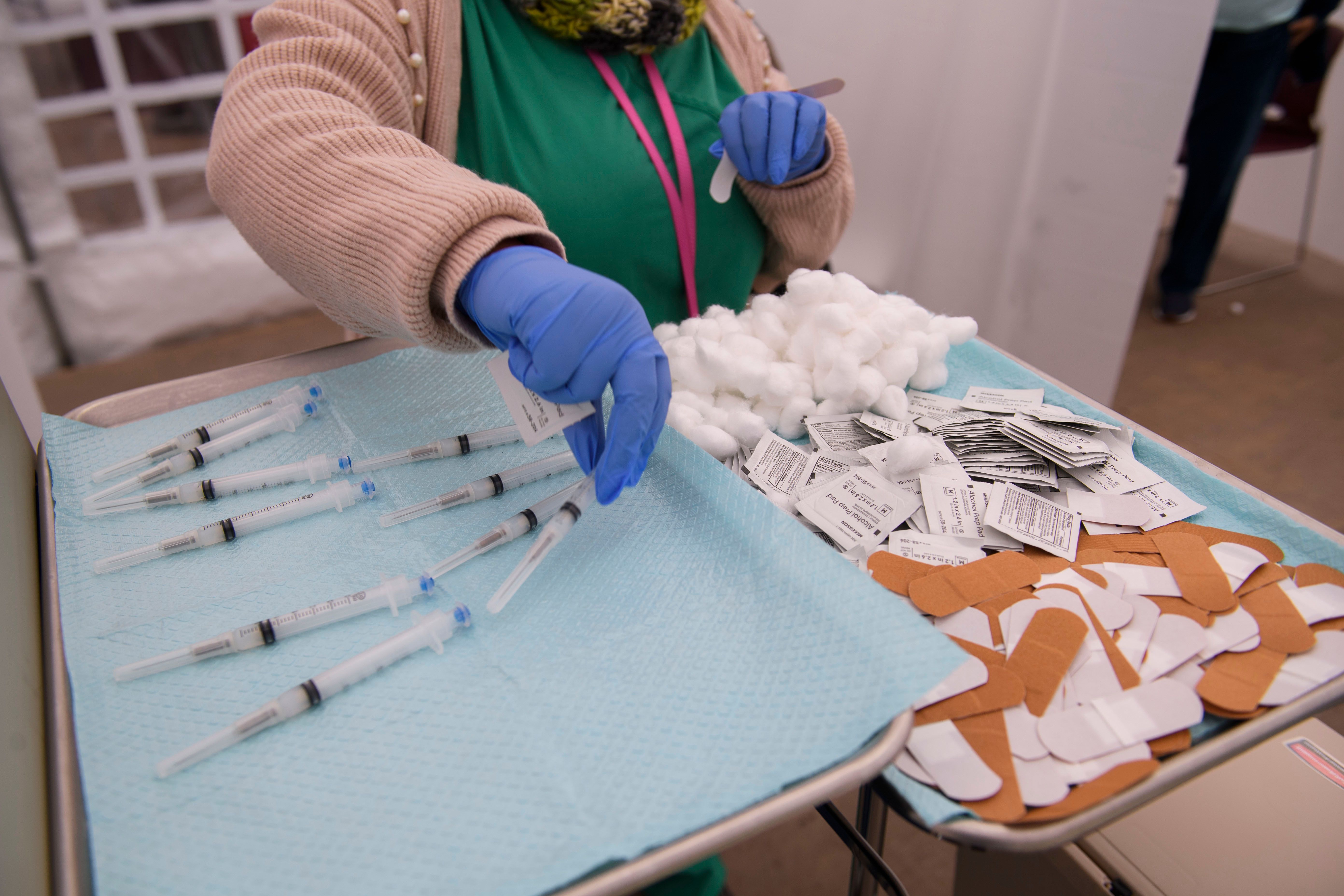 Syringes filled with a dose of the Covid-19 vaccine await to be administered at the Kedren Community Health Center on Jan. 25, 2021, in Los Angeles. (PATRICK T. FALLON/AFP via Getty Images)