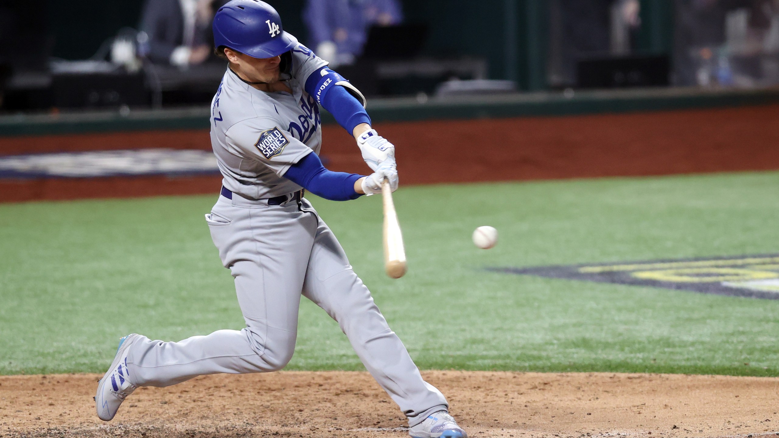 Enrique Hernandez #14 of the Los Angeles Dodgers hits an RBI double against the Tampa Bay Rays during the sixth inning in Game Four of the 2020 MLB World Series at Globe Life Field on October 24, 2020 in Arlington, Texas. (Tom Pennington/Getty Images)