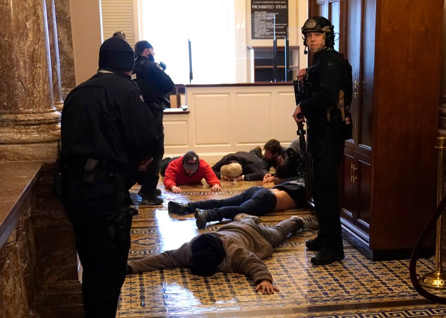 U.S. Capitol Police stand detain protesters outside of the House Chamber during a joint session of Congress on January 06, 2021 in Washington, DC. (Drew Angerer/Getty Images)