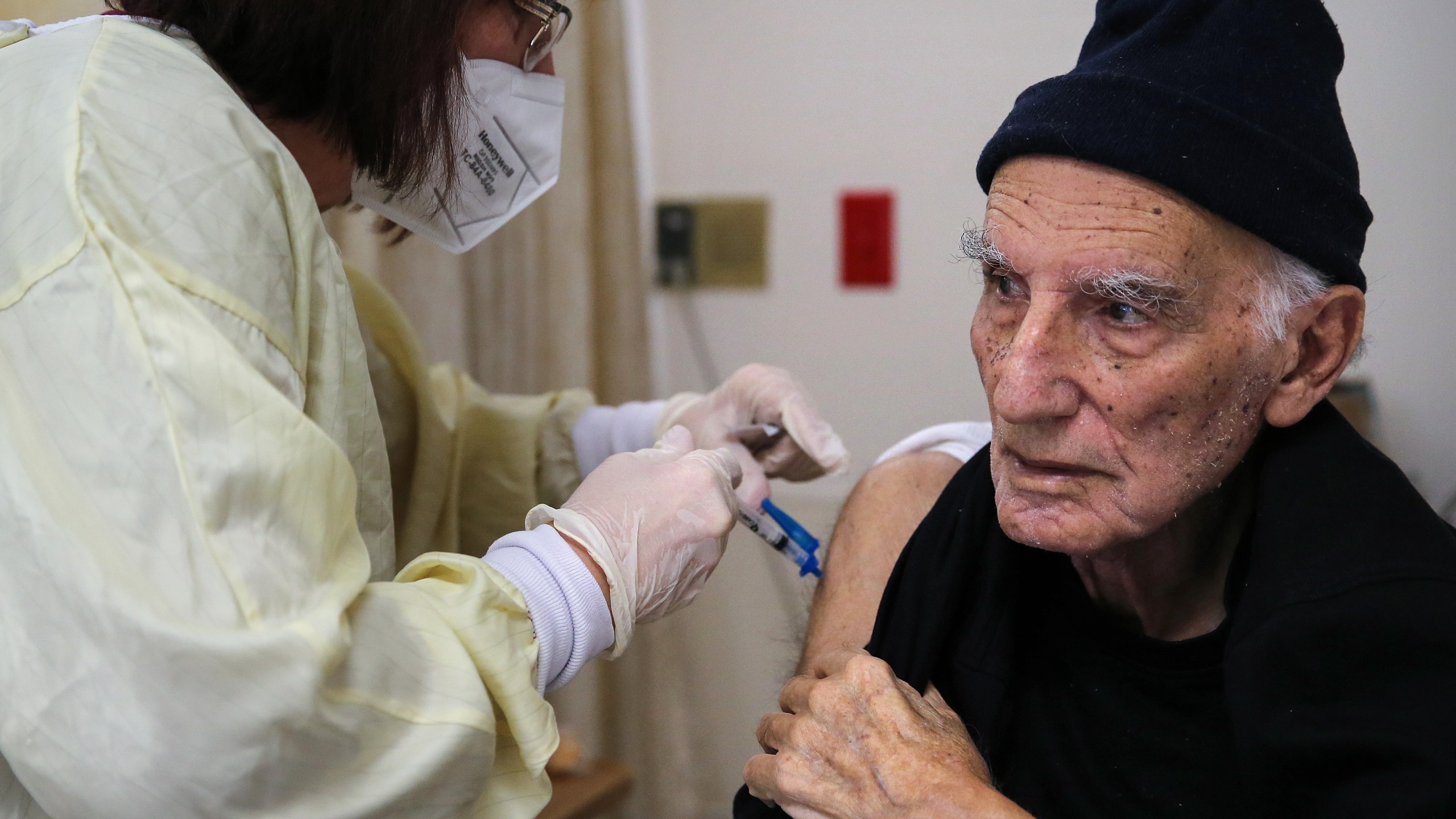 A nurse administers a dose of the Moderna COVID-19 vaccine to a resident at the Ararat Nursing Facility in the Mission Hills neighborhood of Los Angeles on Jan. 8, 2021 in Los Angeles.(Mario Tama/Getty Images)