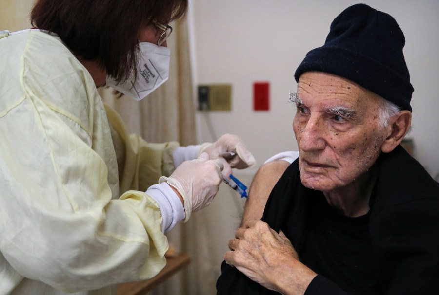 A nurse administers a dose of the Moderna COVID-19 vaccine to a resident at the Ararat Nursing Facility in the Mission Hills neighborhood of Los Angeles on Jan. 8, 2021 in Los Angeles.(Mario Tama/Getty Images)