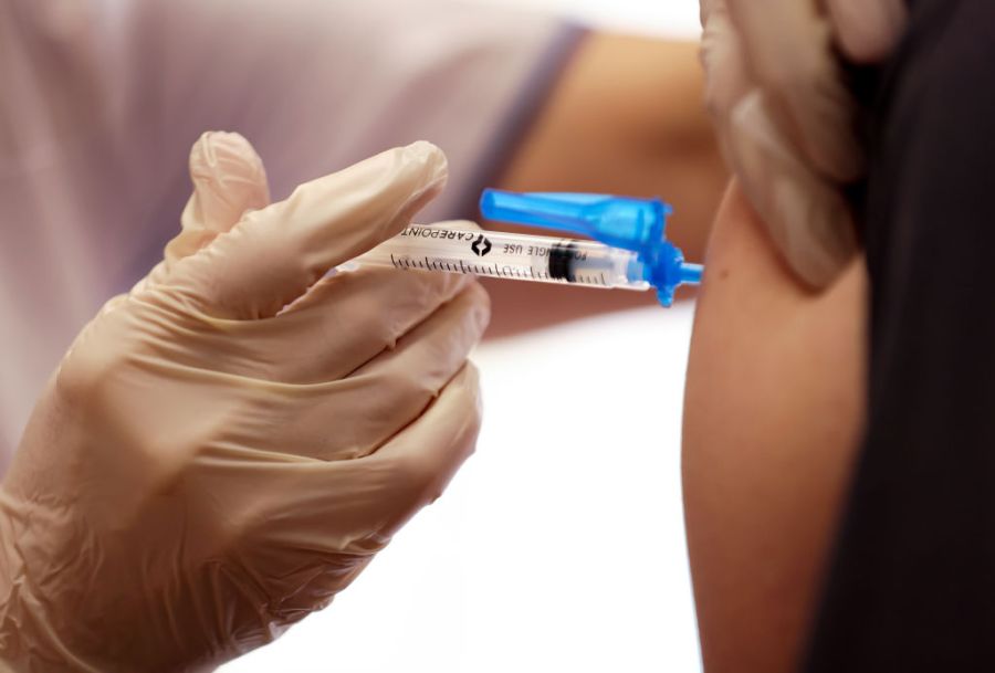 A dose of the Moderna COVID-19 vaccine is administered to a staff member at a nursing facility in Mission Hills on Jan. 7, 2021. (Mario Tama/Getty Images)