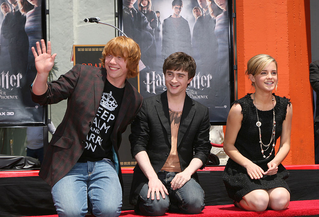 In this file photo, actor Rupert Grint, actor Daniel Radcliffe and actress Emma Watson attend the Harry Potter cast "Hand, Foot and Wand-Print" ceremony held at Grauman's Chinese Theater July 9, 2007 in Hollywood. (Alberto E. Rodriguez/Getty Images)