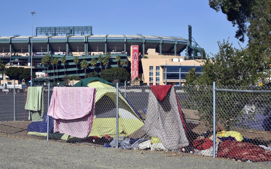 Blankets and tents are seen at a homeless encampment along the Santa Ana river bed near Angel Stadium in Anaheim, California on Jan. 23, 2018.(FREDERIC J. BROWN/AFP via Getty Images)