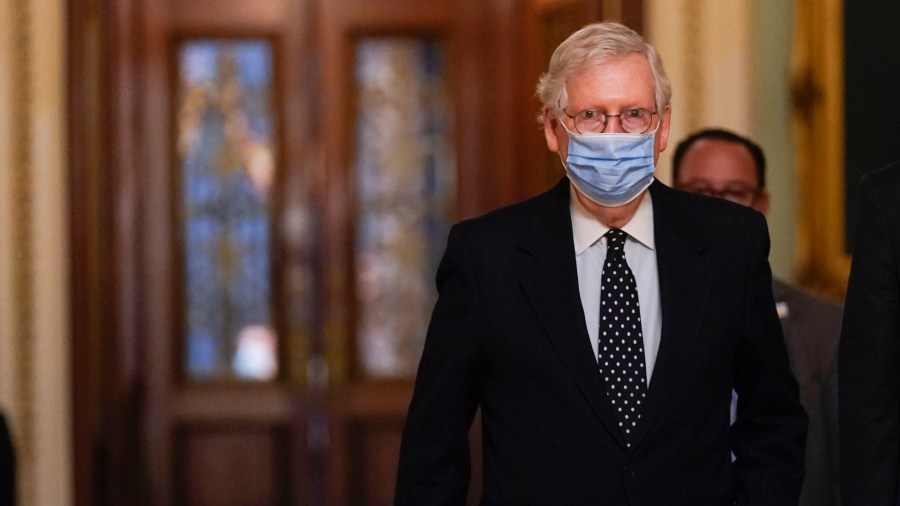 In this Jan. 6, 2021, photo, Senate Majority Leader Mitch McConnell of Ky., walks from the Senate floor to his office on Capitol Hill in Washington. Now that the House has impeached President Donald Trump for the second time, House Speaker Nancy Pelosi must figure out the best strategy for arguing the case before the Senate. Senate rules say the trial must start soon after the chamber receives the article of impeachment, which cites “incitement of insurrection” after an angry mob of Trump’s supporters invaded the Capitol last week. (AP Photo/Manuel Balce Ceneta)