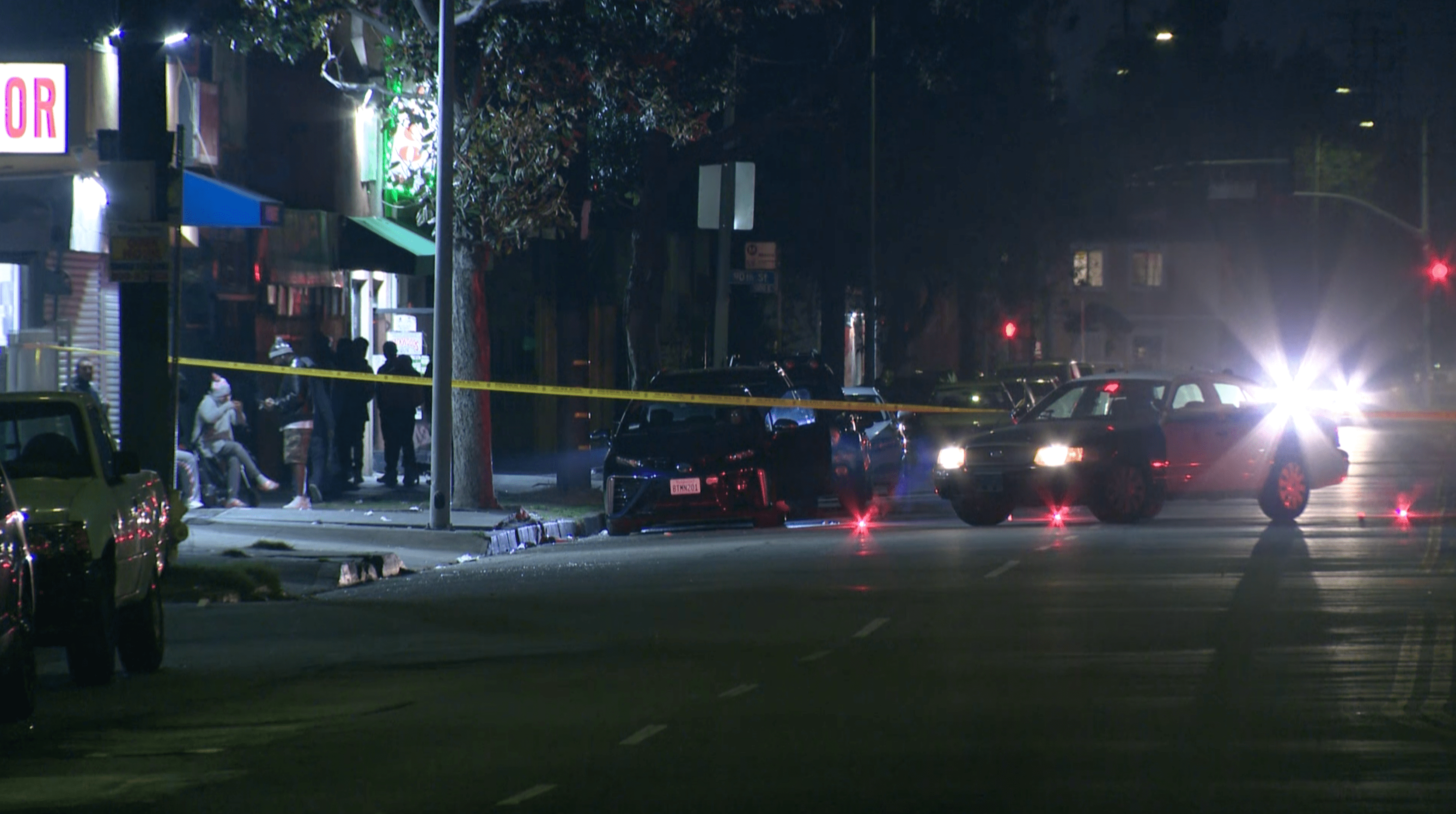 Authorities respond to investigate a triple shooting in the Green Meadows neighborhood of South Los Angeles on Jan. 12, 2021. (KTLA)