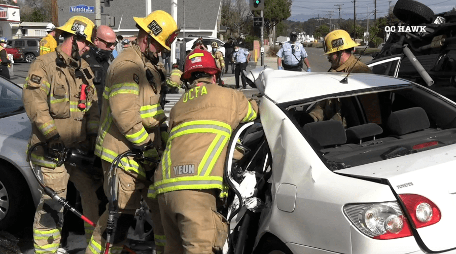 Firefighters work to extricate victims in a Fullerton crash on Jan. 27, 2021. (OC Hawk)