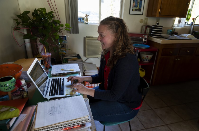 Los Angeles Unified School teacher Casey Jagusch teaches her students remotely from her kitchen table. (Gina Ferazzi / Los Angeles Times)