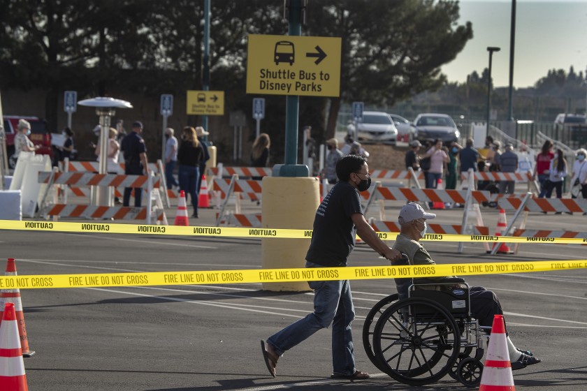 People line up Jan. 13 at the Disneyland parking lot to receive COVID-19 vaccinations. (Allen J. Schaben / Los Angeles Times)