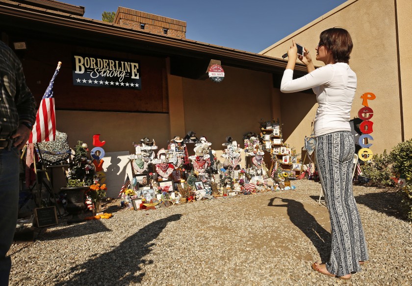 Shaina Miller, who knew 10 of the 12 victims of the Borderline Bar and Grill mass shooting in Thousand Oaks, visits the memorial a year after the November 2018 massacre. (Al Seib / Los Angeles Times)