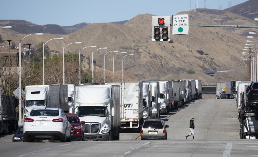 Trucks are parked along Castaic Road in Castaic on Jan. 26, 2021 morning waiting for the 5 Freeway to reopen.(Myung J. Chun / Los Angeles Times)