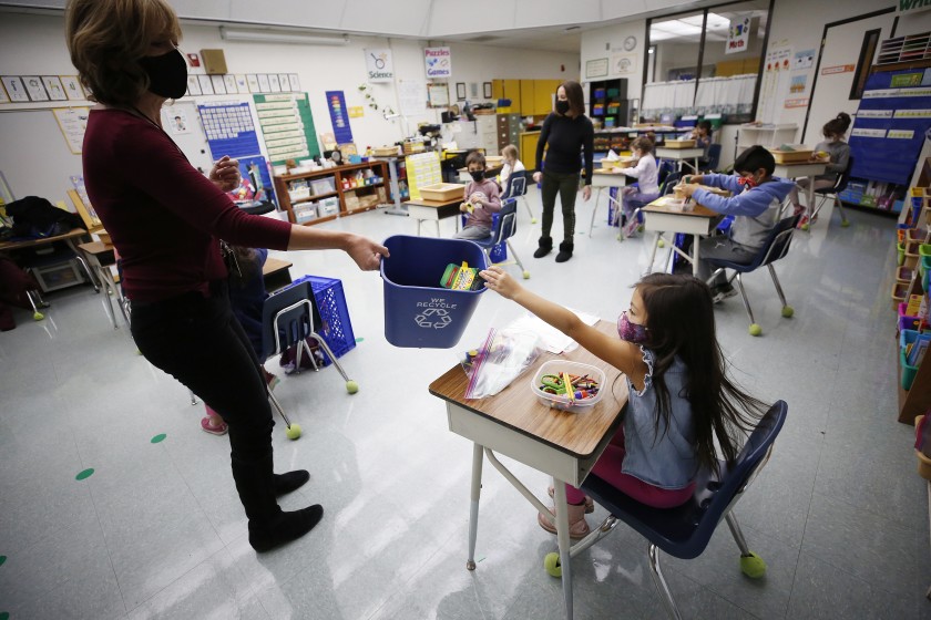 Kindergarten teacher Jennifer Klein collects crayons at Lupin Hill Elementary in Calabasas, which school district officials hope to keep open despite L.A. County’s surge in coronavirus infections.(Al Seib / Los Angeles Times)