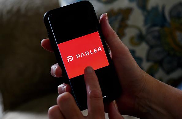 This illustration picture shows social media application logo from Parler displayed on a smartphone in Arlington, Virginia on July 2, 2020. (Olivier Douliery/AFP via Getty Images)