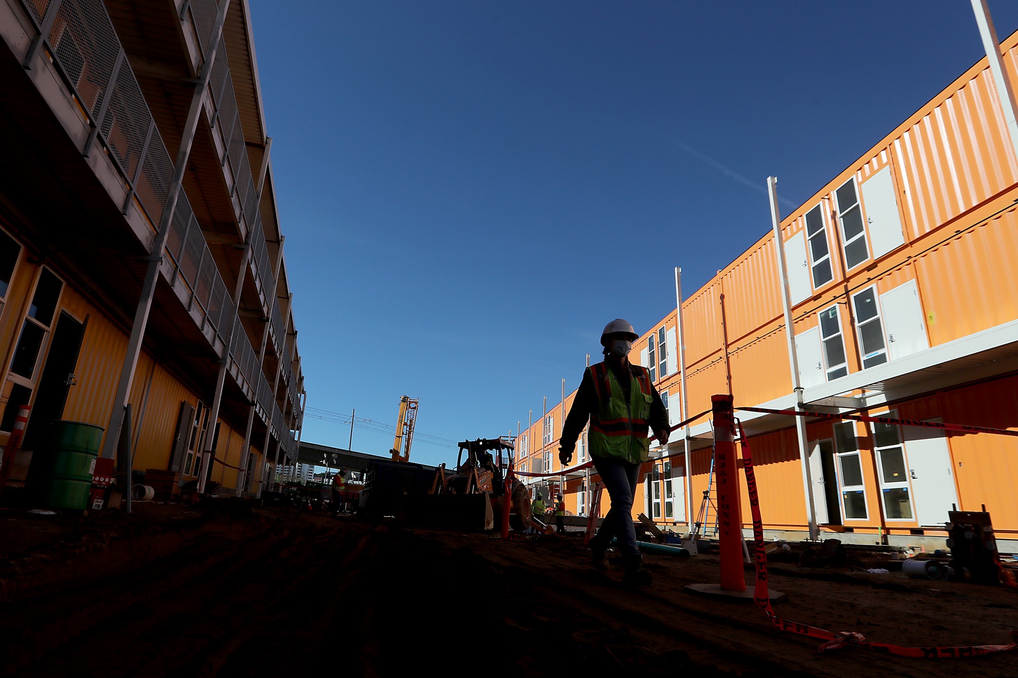 L.A. County contractors are rushing to complete a 232-unit Vignes Street homeless housing development in downtown Los Angeles. Authorities said the project will be a milestone for speed and economy. (Luis Sinco / Los Angeles Times)