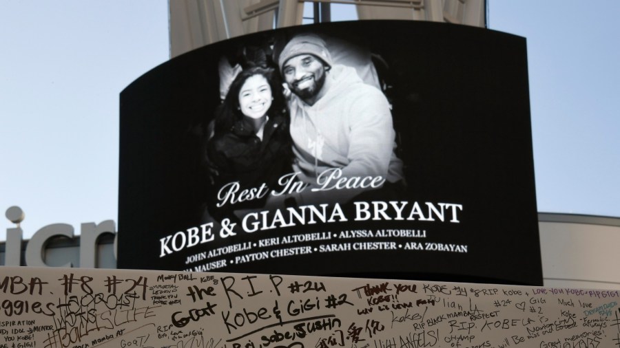 Fans leave condolence message on boards to pay their respects to Kobe Bryant and his daughter Gianna, 13, at a memorial set up outside of Staples Center on January 28, 2020 in Los Angeles, California. (Kevork Djansezian/Getty Images)