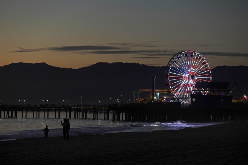 The Ferris wheel at the Santa Monica Pier is lighted in a patriotic display for Veterans Day 2020.(Myung J. Chun / Los Angeles Times)