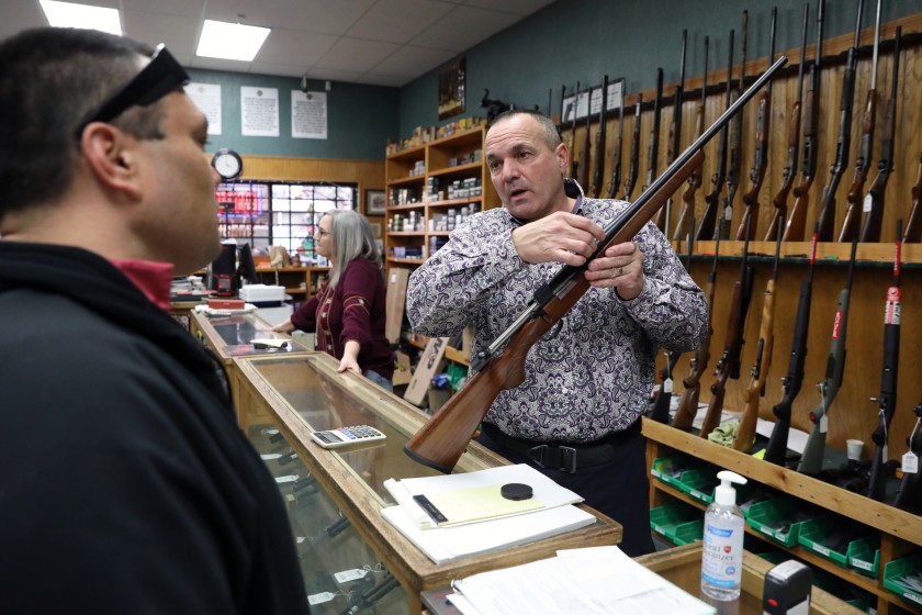 Shasta County Supervisor Patrick Jones is seen in his gun shop in Redding in this undated photo. (Gary Coronado / Los Angeles Times)