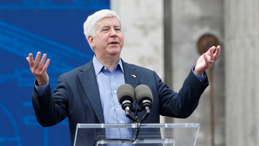 Then Michigan Governor Rick Snyder speaks at a press conference where the Ford Motor Company announced its plans to renovate the historic, 105-year old Michigan Central train station and Detroit's Corktown neighborhood into a hub for Ford's auto technology on June 19, 2018 in Detroit. (Bill Pugliano/Getty Images)