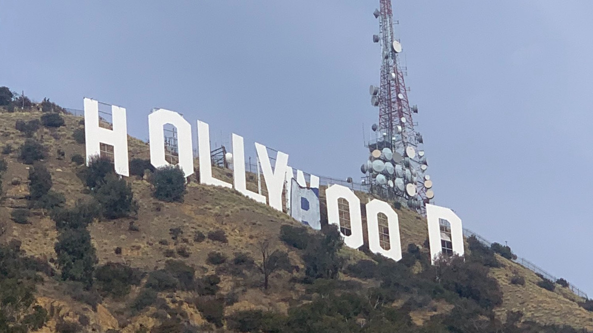 The Hollywood sign is seen on Feb. 1, 2021, after six people scales the area to modify the letters. (@doxalalao via Twitter)