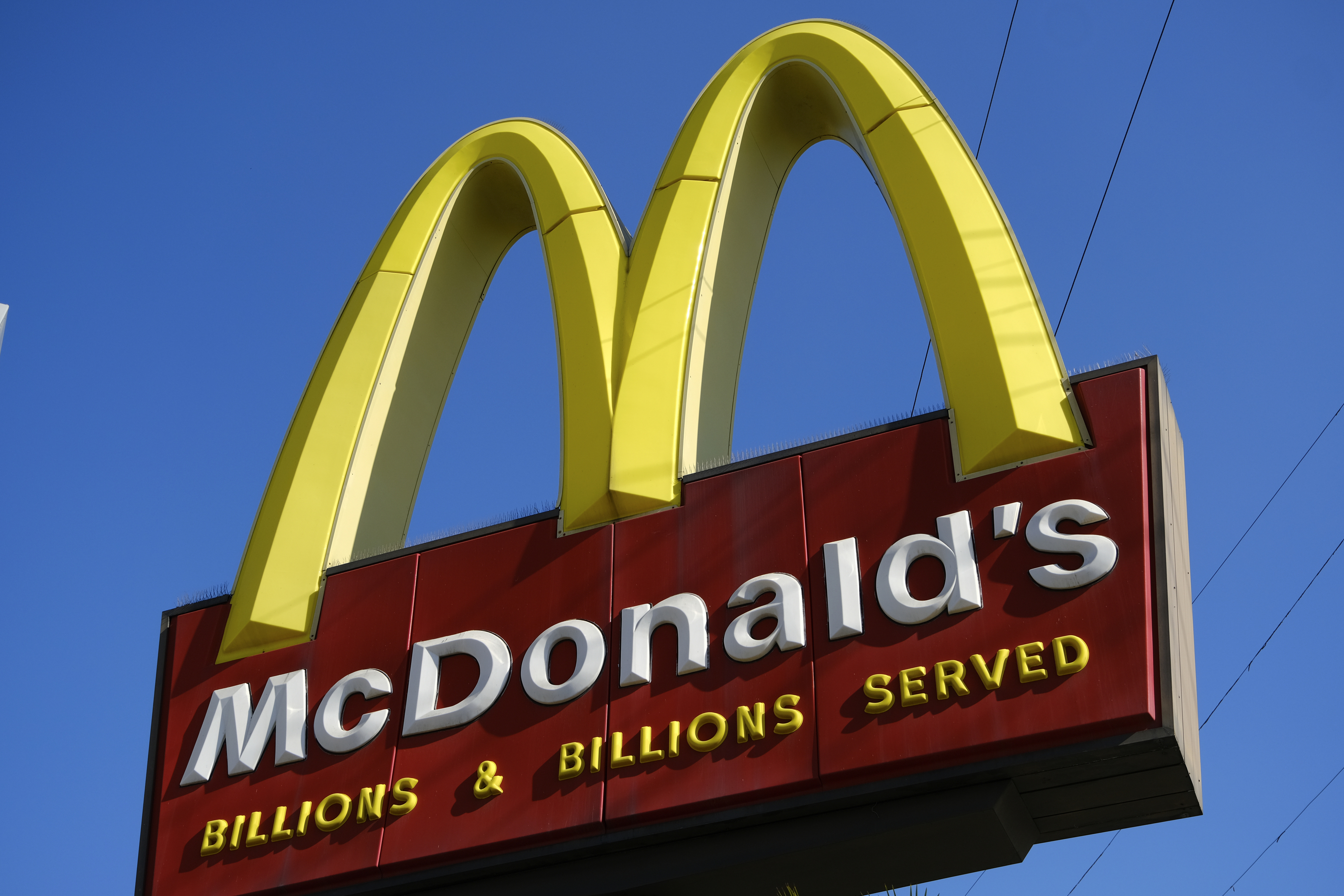 This file photo shows McDonald's sign above one of the fast food restaurant’s California locations on Nov. 25, 2019. (Richard Vogel / Associated Press)