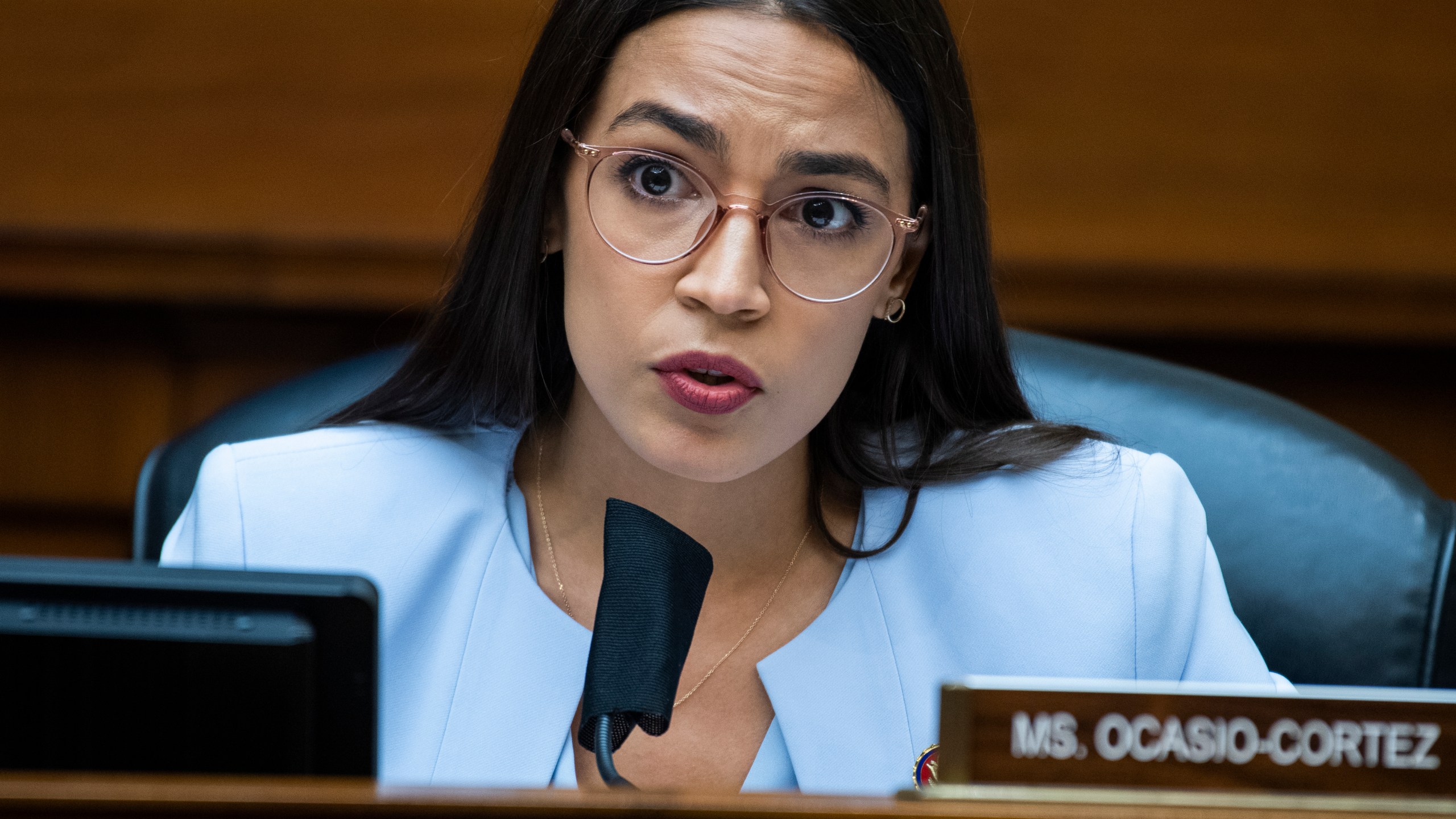 In this Monday, Aug. 24, 2020, file photo, U.S. Rep. Alexandria Ocasio-Cortez, D-N.Y., questions Postmaster General Louis DeJoy during a House Oversight and Reform Committee hearing on the Postal Service on Capitol Hill, in Washington. On Monday, Feb. 1, 2021, a teary-eyed Ocasio-Cortez recounted hiding in her office bathroom as a man repeatedly yelled “Where is she?" during the insurrection at the U.S. Capitol, and also revealed a sexual assault in her past as she talked about trauma. (Tom Williams/Pool Photo via AP, File)