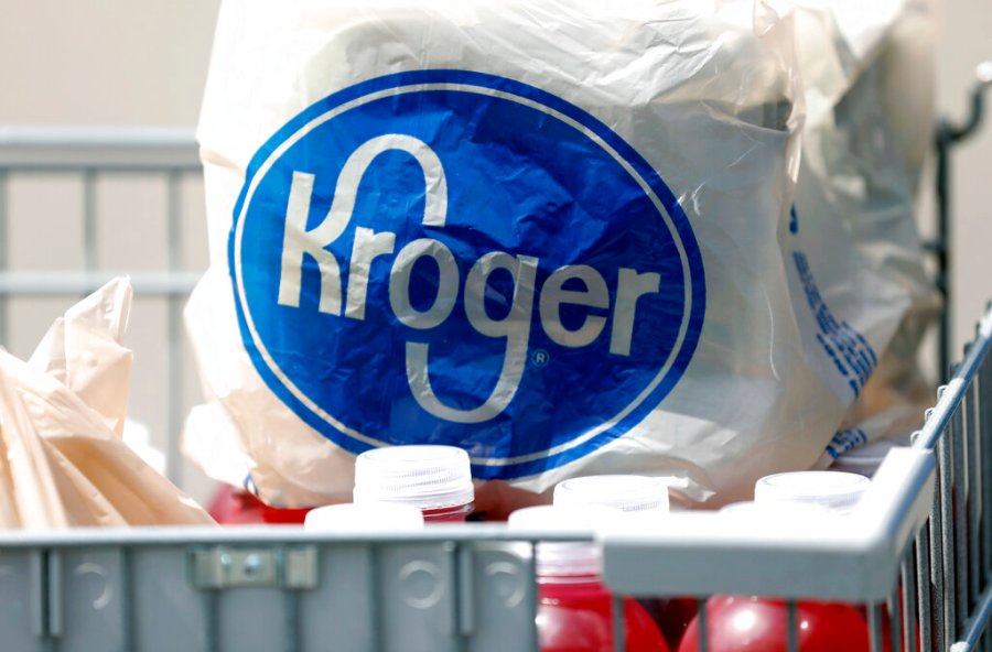 In this June 15, 2017, file photo, bagged purchases from a Kroger grocery store sit in a shopping cart in Flowood, Miss. Kroger Co. (AP Photo/Rogelio V. Solis, File)