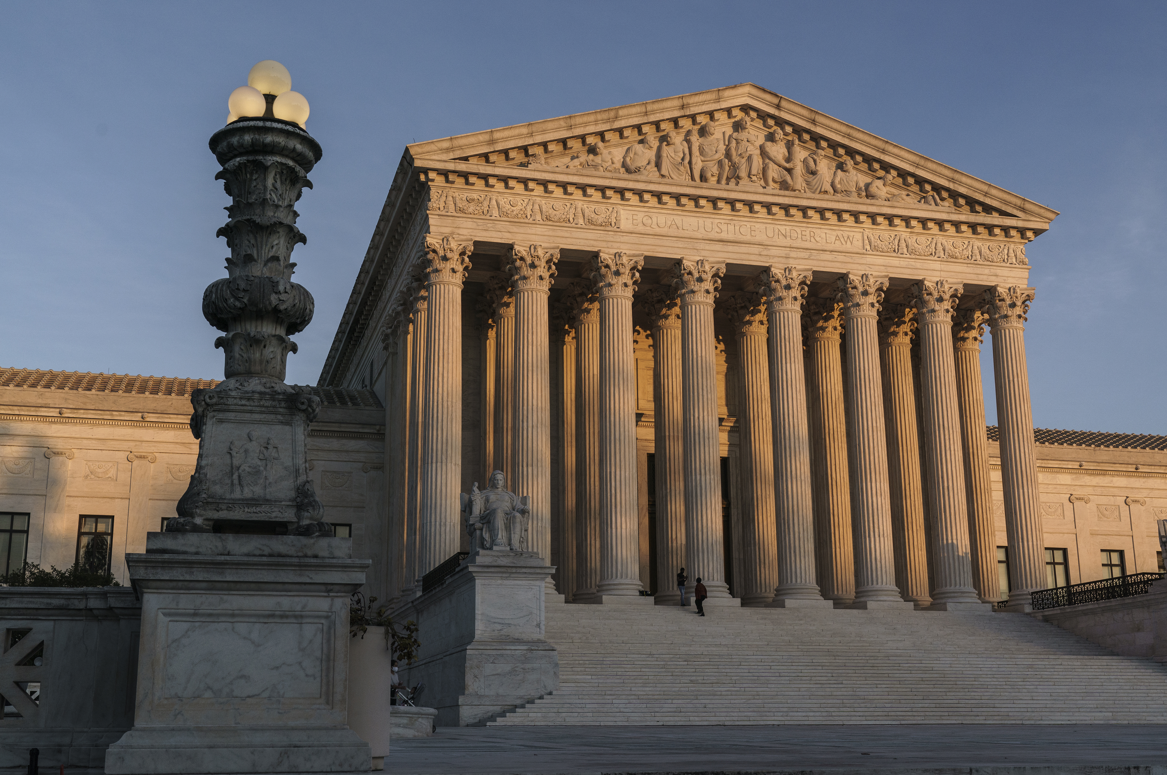 In this Nov. 6, 2020, file photo the Supreme Court is seen as sundown in Washington. (AP Photo/J. Scott Applewhite, File)