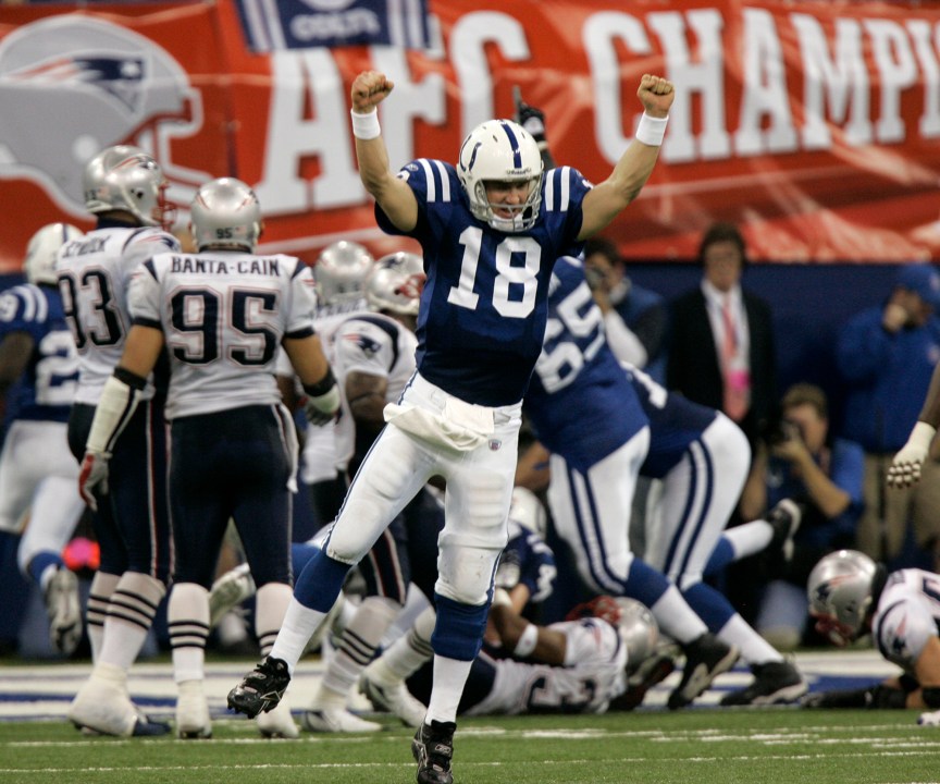 In this Jan. 21, 2007, file photo, Indianapolis Colts quarterback Peyton Manning (18) celebrates running back Joseph Addai's three-yard touchdown run in the fourth quarter of the AFC Championship football game against the New England Patriots, in Indianapolis. (AP Photo/Amy Sancetta)