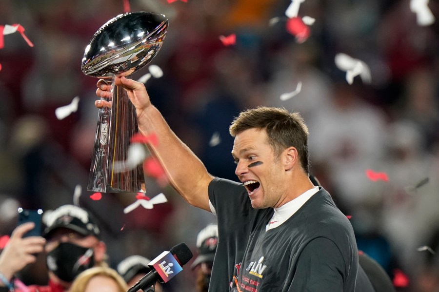 Tampa Bay Buccaneers quarterback Tom Brady celebrates with the Vince Lombardi Trophy after the NFL Super Bowl 55 football game against the Kansas City Chiefs Sunday, Feb. 7, 2021, in Tampa, Fla. (AP Photo/Lynne Sladky)