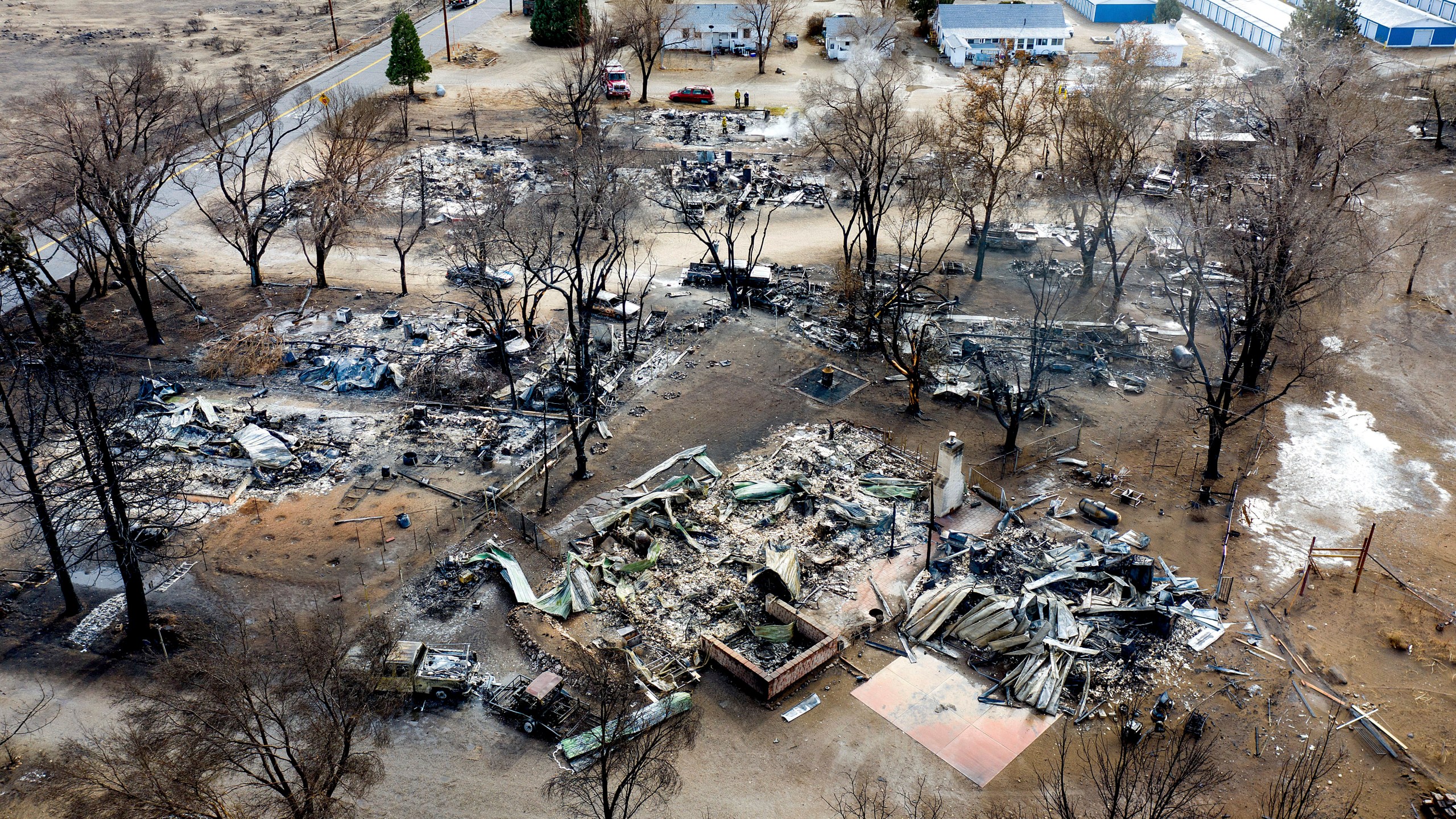 In this Nov. 18, 2020 file photo taken by a drone, residences destroyed by the Mountain View Fire line a street in the Walker community in Mono County, Calif. (AP Photo/Noah Berger)