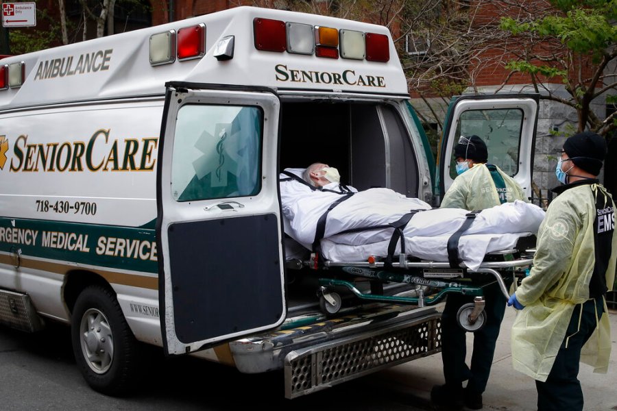 In this April 17, 2020, file photo, a patient is loaded into an ambulance by emergency medical workers outside Cobble Hill Health Center in the Brooklyn borough of New York. x(AP Photo/John Minchillo, File)