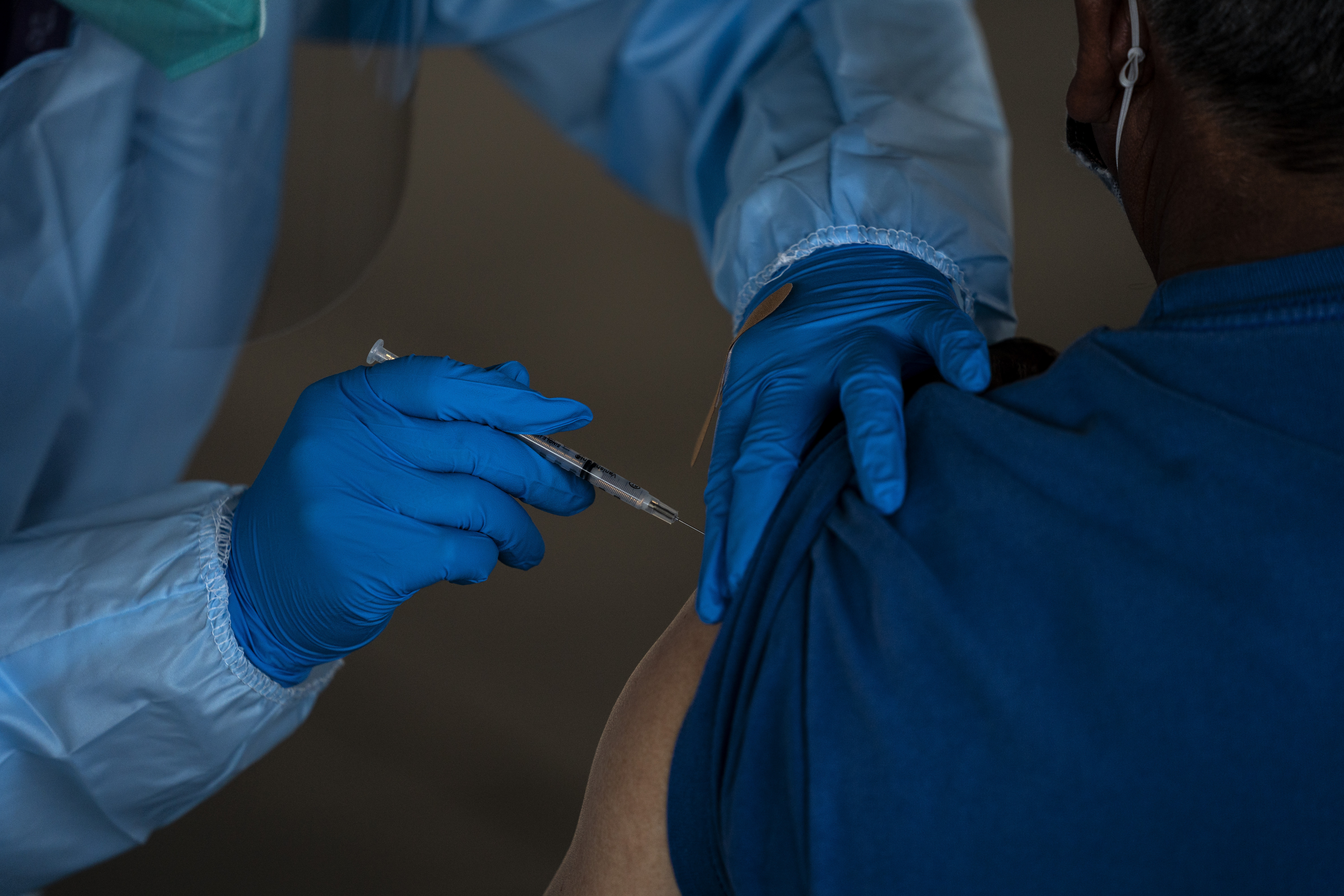 In this Jan. 21, 2021, file photo, a person receives the Pfizer-BioNTech COVID-19 vaccine in Mecca, Calif. (AP Photo/Jae C. Hong, File)