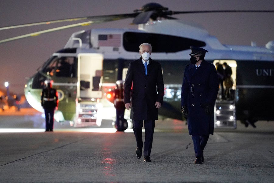 President Joe Biden walks to board Air Force One for a trip to Camp David, Friday, Feb. 12, 2021, in Andrews Air Force Base, Md. (AP Photo/Evan Vucci)