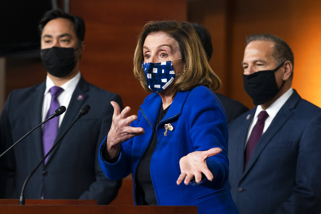 House Speaker Nancy Pelosi of Calif., with impeachment managers Rep. David Cicilline, D-R.I., and Rep. Joaquin Castro, D-Texas, speaks to members of the media during a news conference on Capitol Hill in Washington, after the U.S. Senate voted not guilty, to acquit former President Donald Trump of inciting riot at U.S. Capitol, ending impeachment trial, Saturday, Feb. 13, 2021. (AP Photo/Manuel Balce Ceneta)