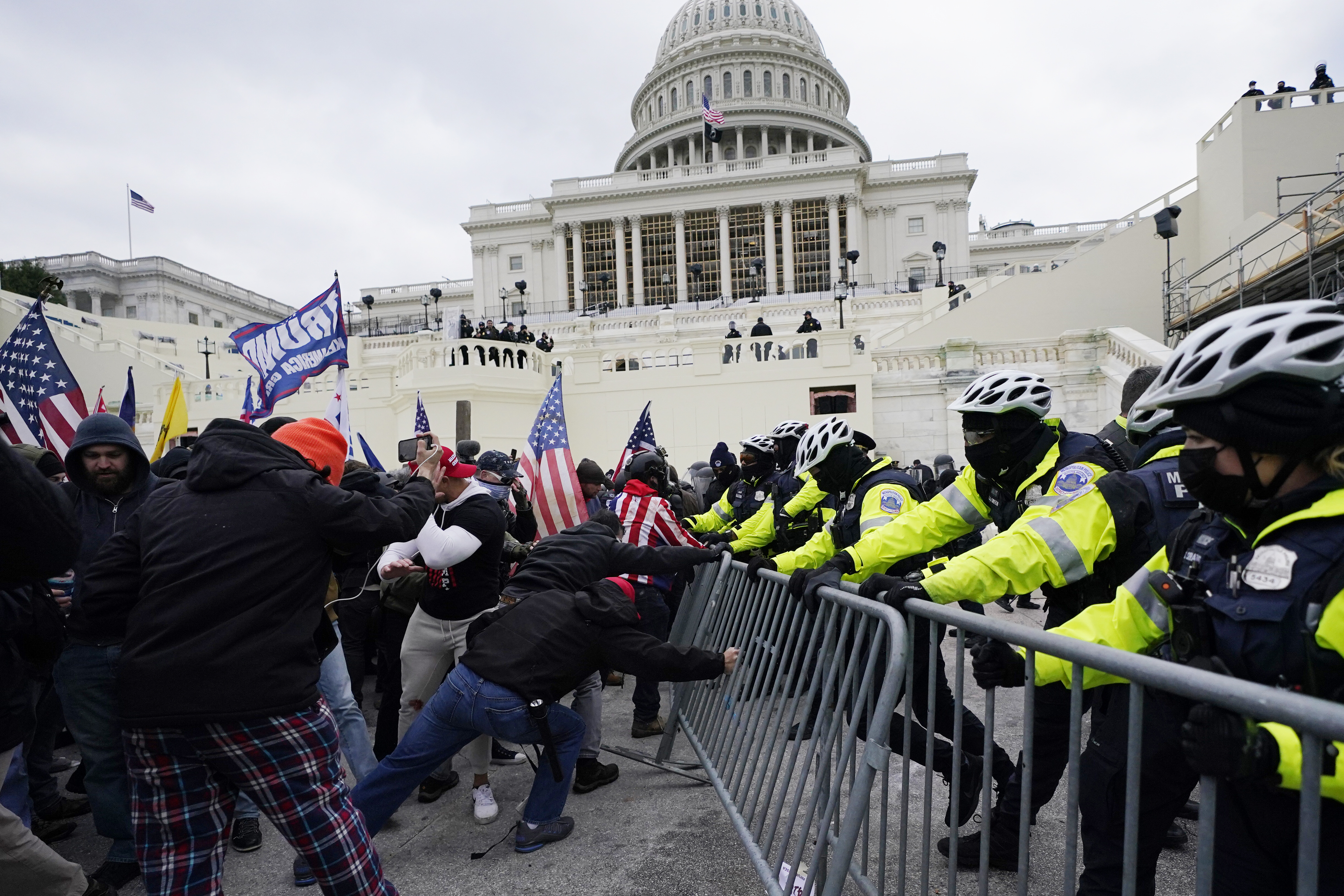 In this Jan. 6, 2021 file photo, rioters try to break through a police barrier at the Capitol in Washington. (AP Photo/Julio Cortez, File)