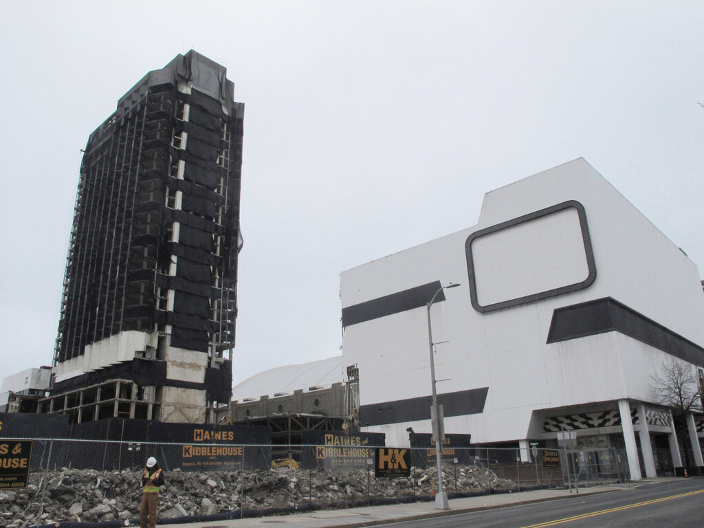 This Feb. 16, 2021 photo shows the former Trump Plaza casino in Atlantic City, N.J. on the day before its main tower, left, was to be imploded. (AP Photo/Wayne Parry)