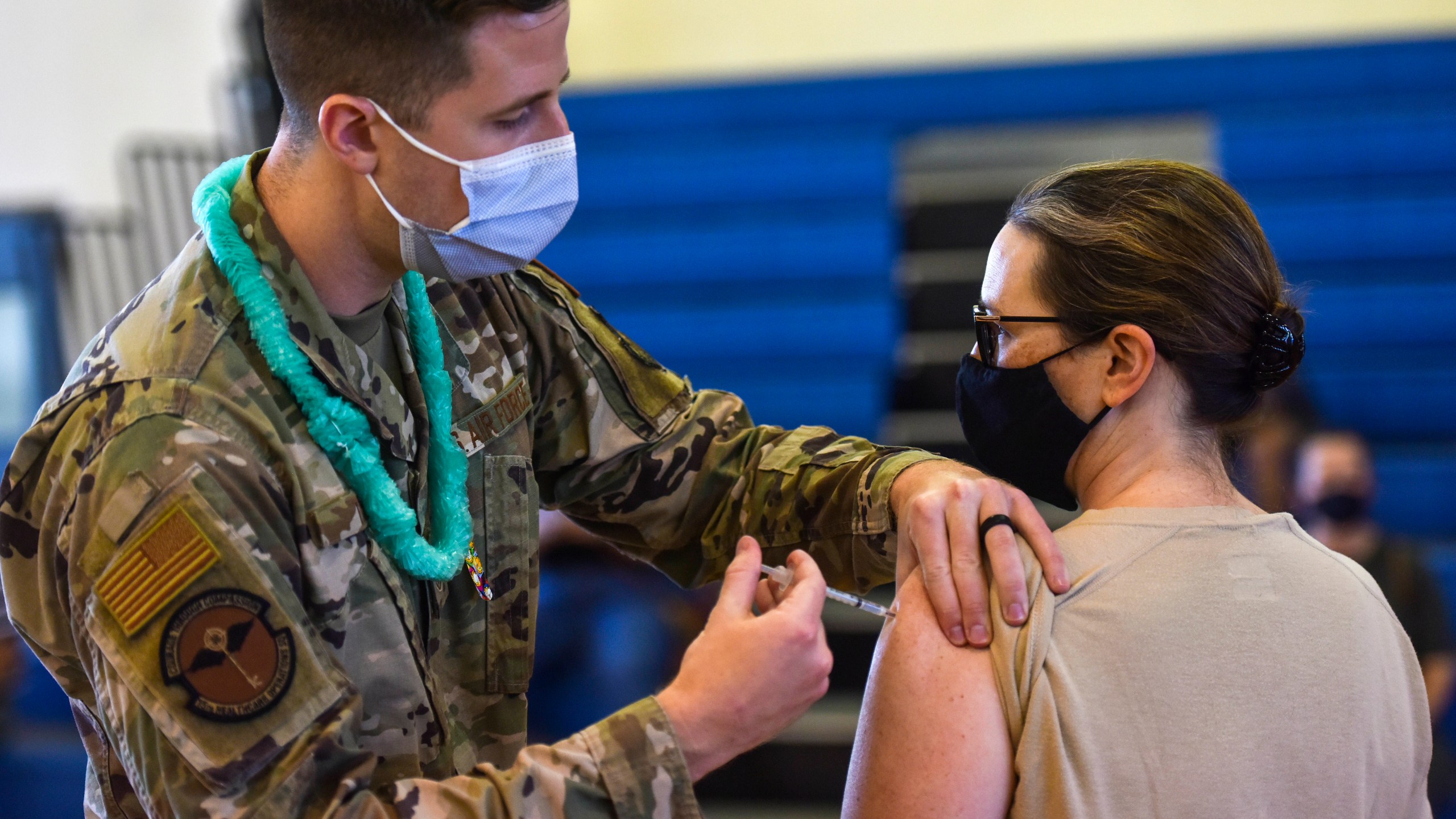 In this Feb. 9, 2021 photo provided by the Department of Defense, Hickam 15th Medical Group host the first COVID-19 mass vaccination on Joint Base Pearl Harbor-Hickam. By the thousands, U.S. service members are refusing or putting off the COVID-19 vaccine, as frustrated commanders scramble to knock down internet rumors and find the right pitch that will convince troops to take the shot. Some Army units are seeing as few as a third agree to the vaccine, others are higher. (U.S. Air Force Tech. Sgt. Anthony Nelson Jr./Department of Defense via AP)