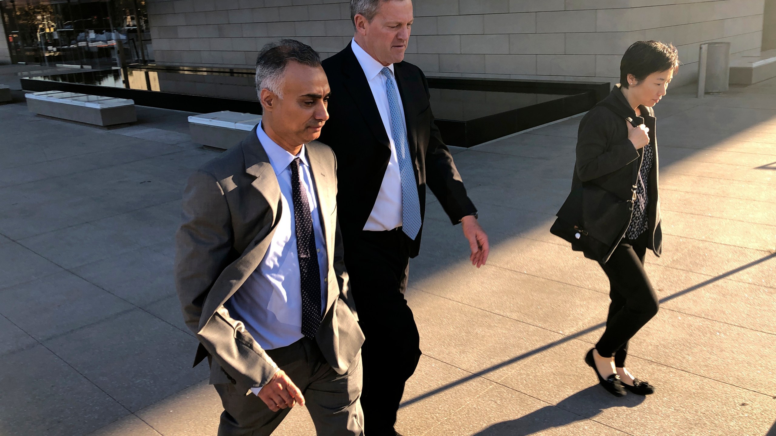 In this Friday, Nov. 22, 2019 file photo, Imaad Zuberi, left, leaves a federal courthouse with his attorney Thomas O'Brien, second from left, in Los Angeles. (Brian Melley/Associated Press)