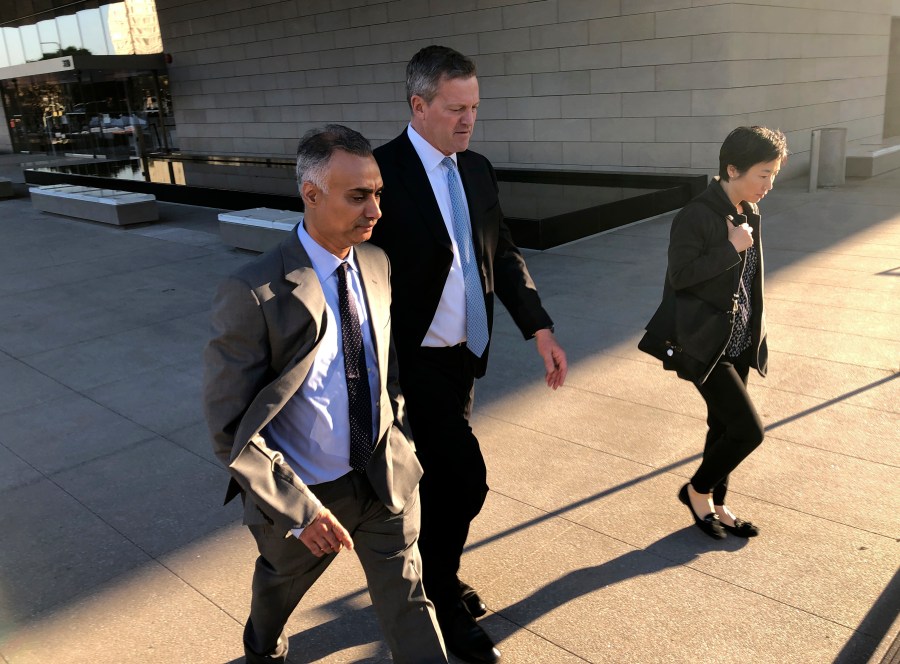 In this Friday, Nov. 22, 2019 file photo, Imaad Zuberi, left, leaves a federal courthouse with his attorney Thomas O'Brien, second from left, in Los Angeles. (Brian Melley/Associated Press)