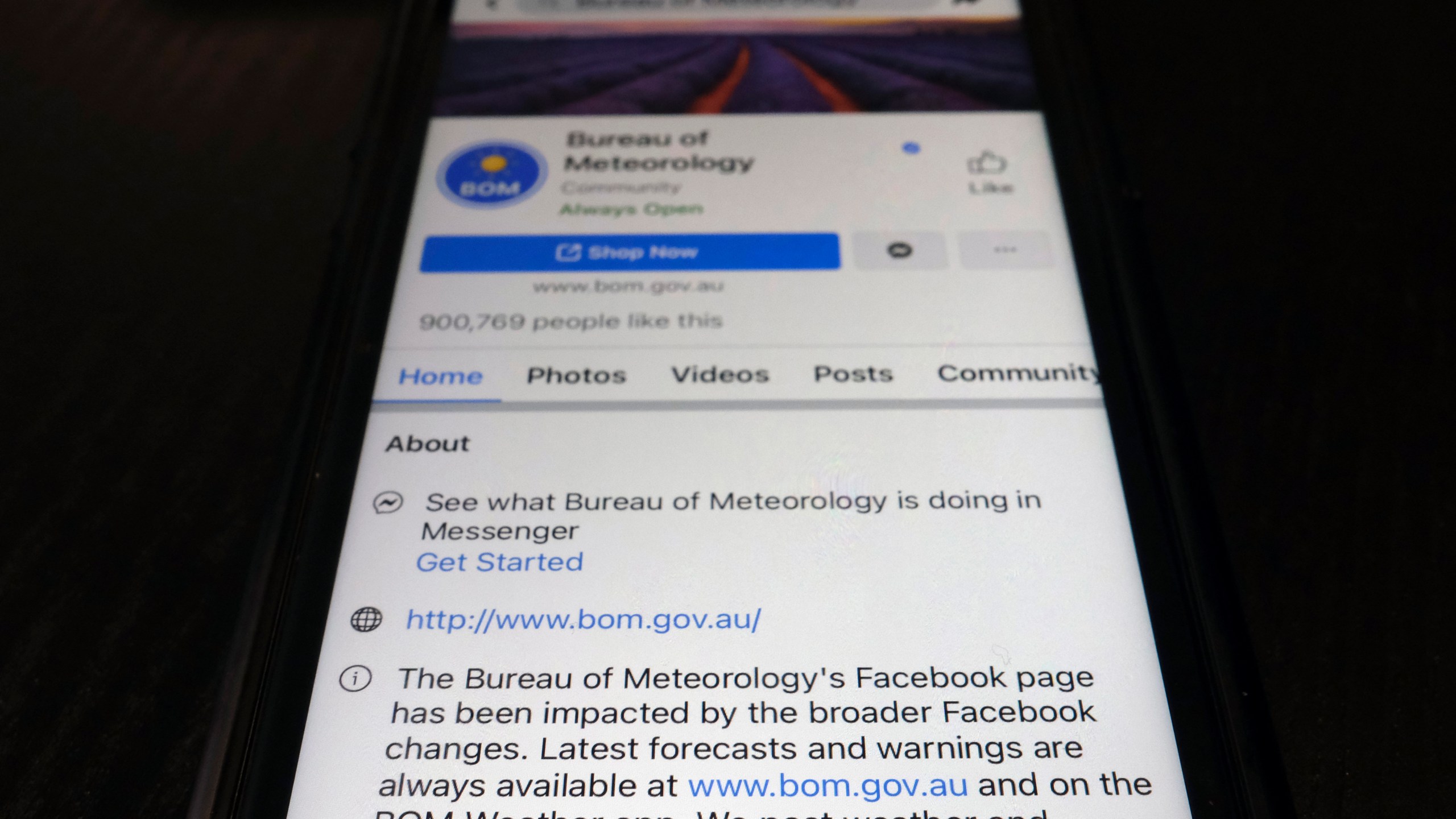 A disclaimer is shown on the bottom of Australia's Bureau of Meteorology page on the Facebook app Thursday, Feb. 18, 2021, in Tokyo. Australia's government has condemned Facebook over its shock move to prevent Australians sharing news that had also blocked some government communications. The Bureau of Meteorology's weather warnings, a Hobart women's shelter and the Betoota Advocate, a satirical website named after an Australian ghost town, were among those surprised to find their content blocked at least temporarily. (AP Photo/Kiichiro Sato)