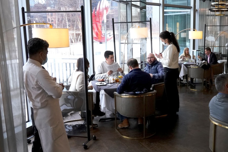 In this Jan. 27, 2021, file photo, patrons enjoy lunch indoors at Gibsons Italia restaurant in Chicago. States are beginning to ease coronavirus restrictions, but health experts say we don’t know enough yet about variants to roll back measures that could help slow their spread. (AP Photo/Charles Rex Arbogast, File)