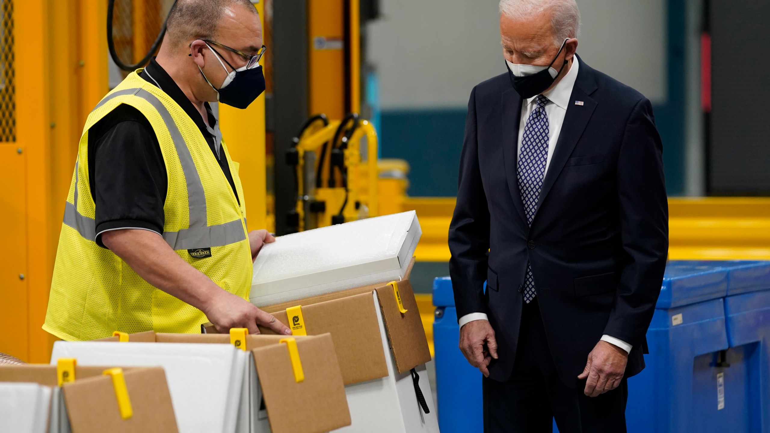 President Joe Biden tours a Pfizer manufacturing site, Friday, Feb. 19, 2021, in Portage, Mich. (AP Photo/Evan Vucci)