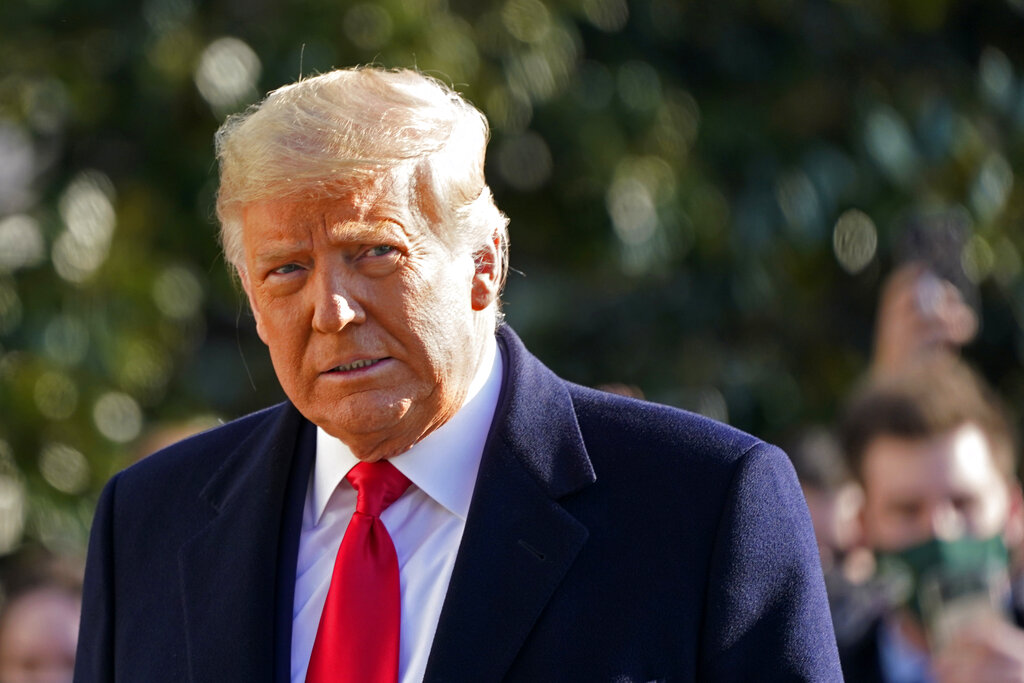 President Donald Trump walks to board Marine One on the South Lawn of the White House on Jan. 12, 2021, in Washington. (AP Photo/Gerald Herbert, File )