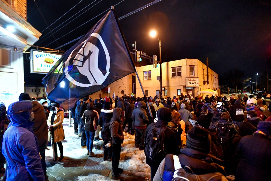 A crowd gathers near the site of Daniel Prude's encounter with police officers in 2020, in Rochester, N.Y., on Feb. 23, 2021. (Adrian Kraus / Associated Press)