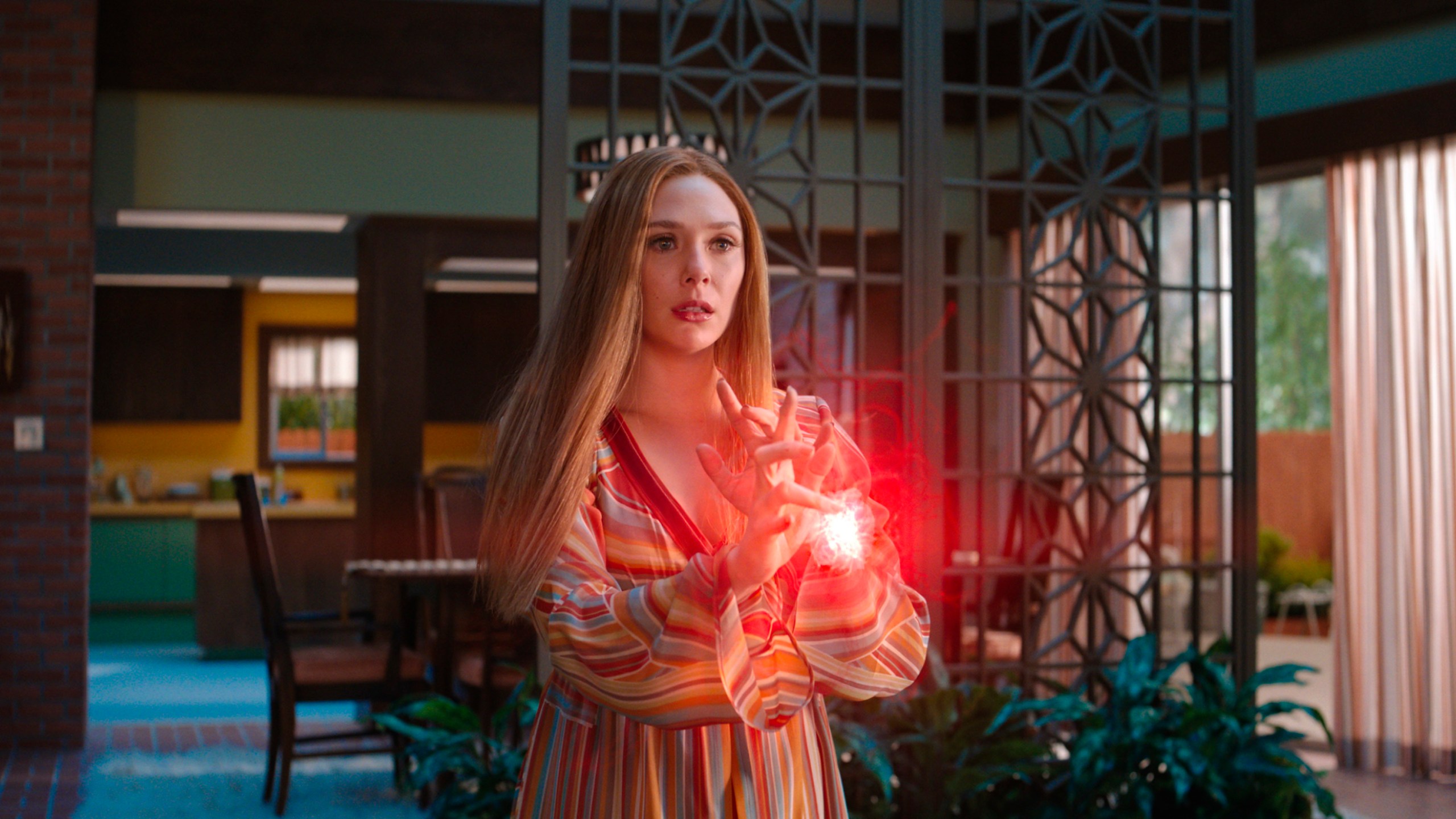 This image provided by Marvel Studios shows Elizabeth Olsen as Wanda Maximoff in a scene from "WandaVision." (Marvel Studios via AP)