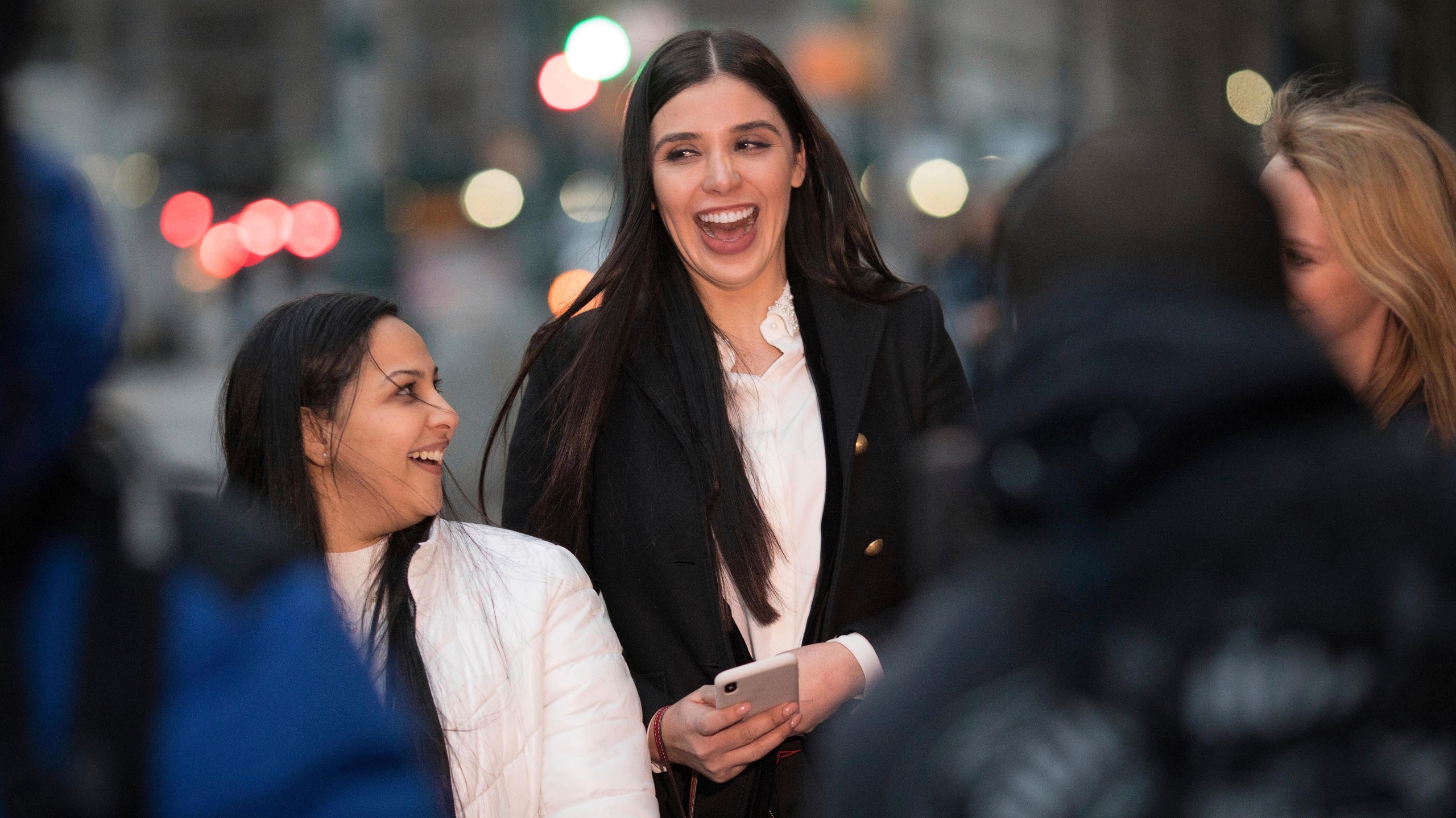 Emma Coronel Aispuro, center, leaves a Brooklyn federal court in New York after attending the trial of her husband Joaquin "El Chapo" Guzman on Jan 17, 2019. (Kevin Hagen / Associated Press)