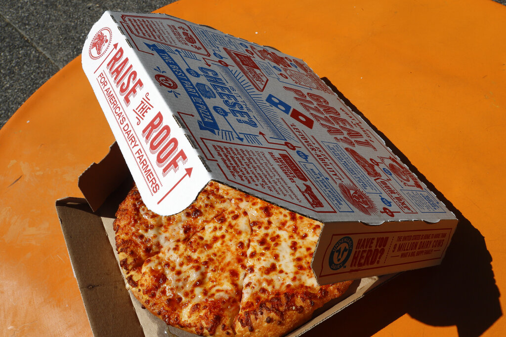 This July 15, 2019, file photo shows a small Domino's pizza made in a Domino's Pizza shop in downtown Pittsburgh. (AP Photo/Gene J. Puskar, File)